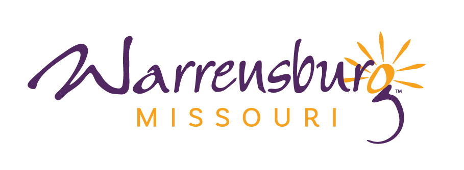 Warrensburg, Missouri logo with the words "Warrensburg Missouri" written in purple. A gold sun is the outline of the top of the lowercase g. 
